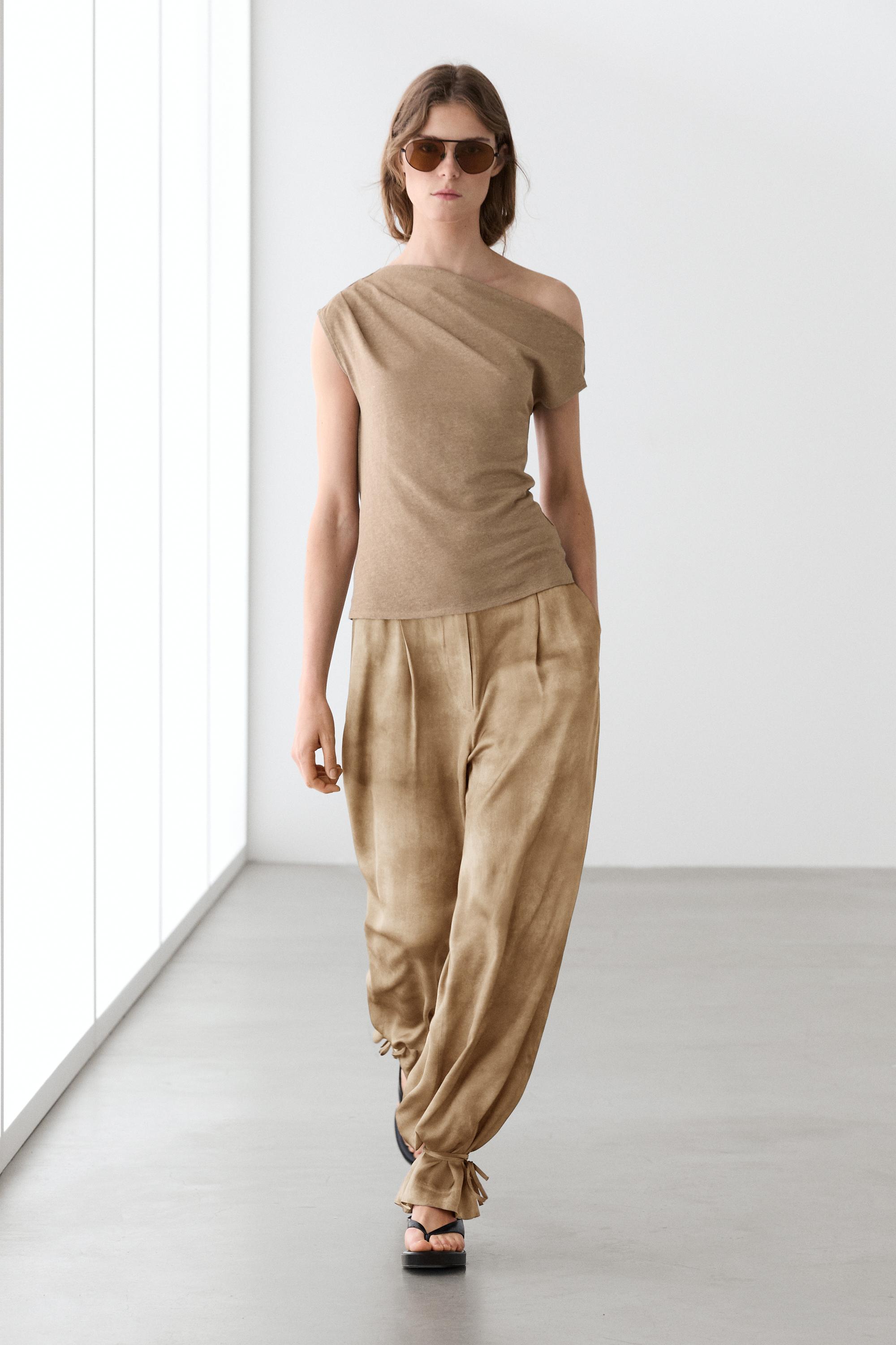 Asymmetric linen blend top with draped detail